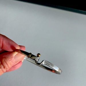 Tiffany & Co bracelet.  Sterling silver and 18k gold bangle “hook and eye”.